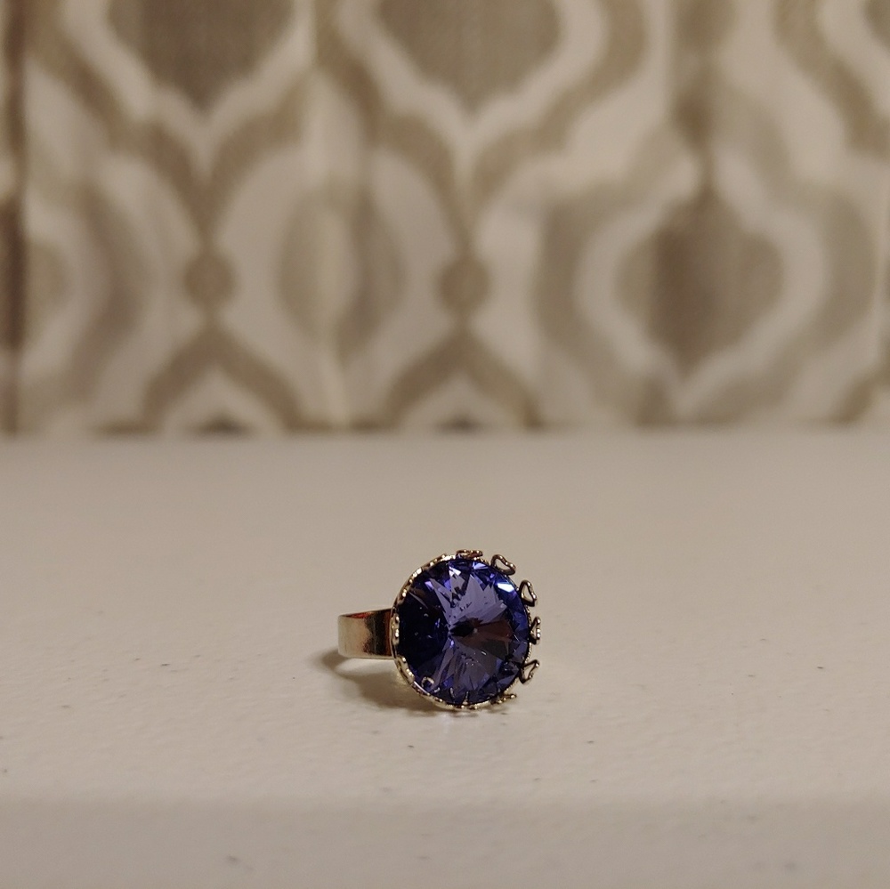 A crystal adjustable silver ring.